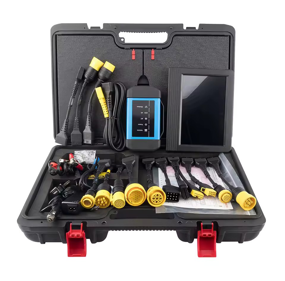 Tabletă de diagnoză Launch așezată lângă modulul heavy-duty și trusa de cabluri pentru camioane